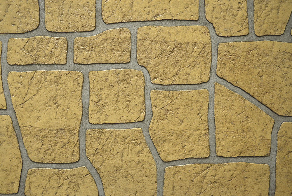 Pochoir Keystone Isoplam avec motif de pierres en arc irrégulier