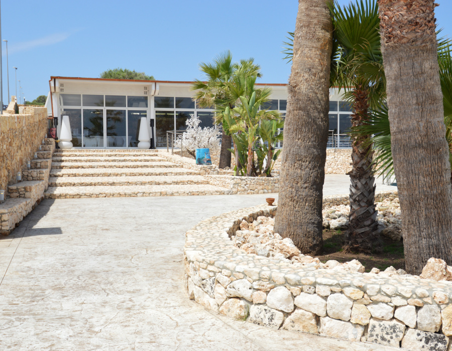 Plam Stampable, stamped concrete floor white color, tawny shades. Hotel Capo Campolato, Siracusa, Italy